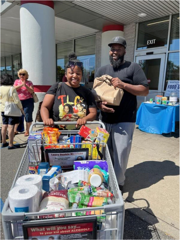 Sister and brother Tamega and Kerwin Vilbon donated a filled shopping cart at the Wantagh Kiwanis Food Drive on July 30th.