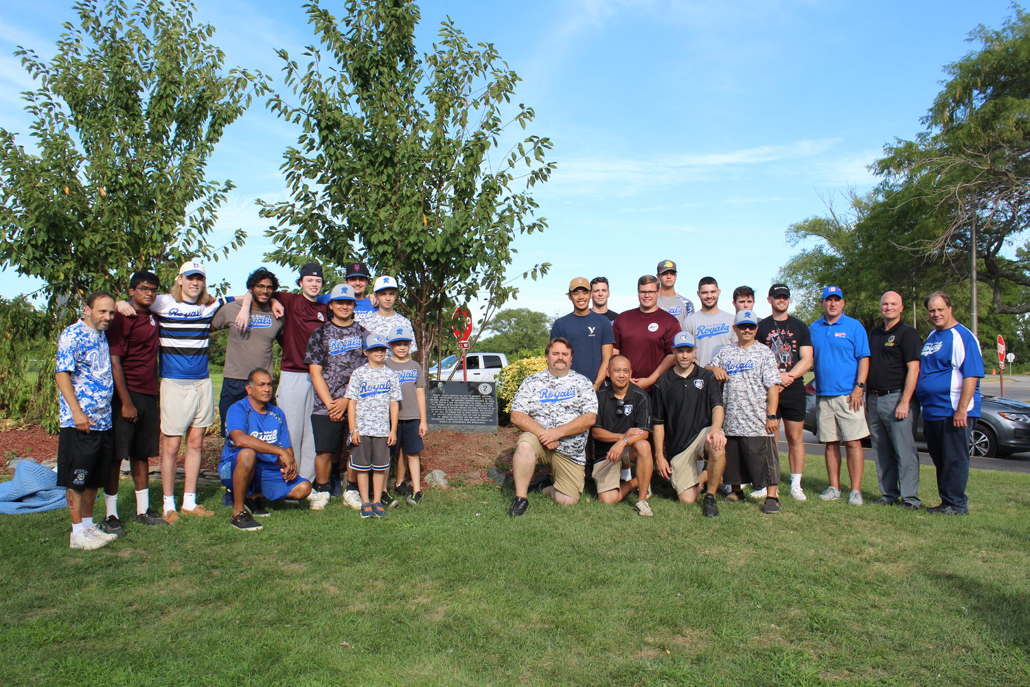 The Baldwin baseball teams gathered with the Oliveri family and Hempstead Town Councilman Christopher Carini in front of Robert Oliveri’s monument, overlooking the baseball field he loved.