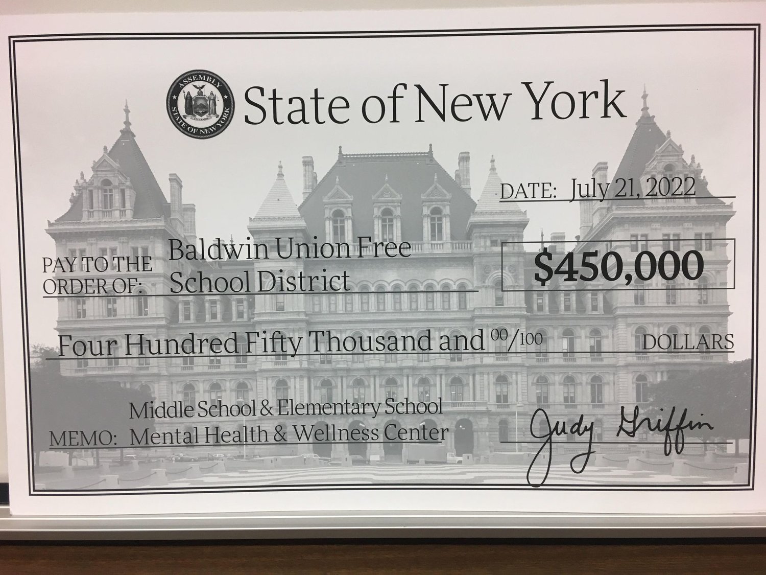 The Baldwin Union Free School District was given a check for $450,000 from the Assembly at the Aug. 10 education board meeting.