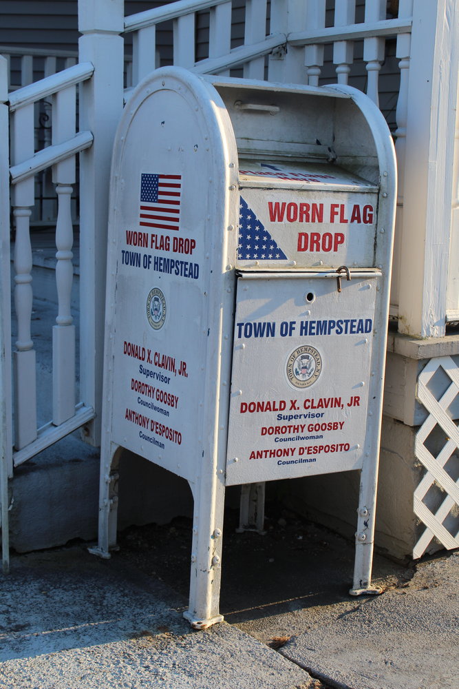 The Worn Flag Drop off box located in the front of American Legion Post #246.