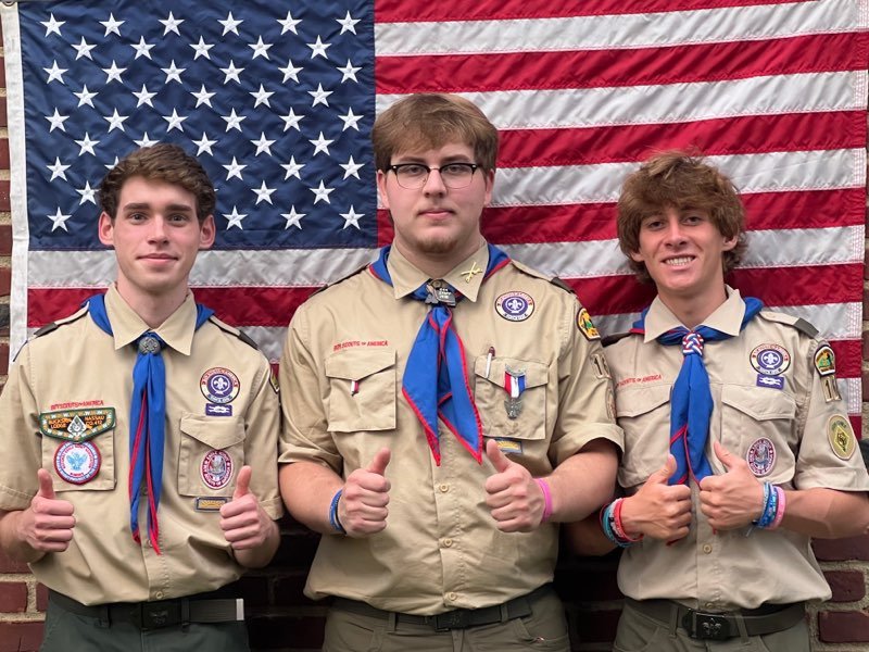 Patrick Burke, left, William Deevy, and Paul Devi were elevated to the rank of Eagle Scout last Sunday.