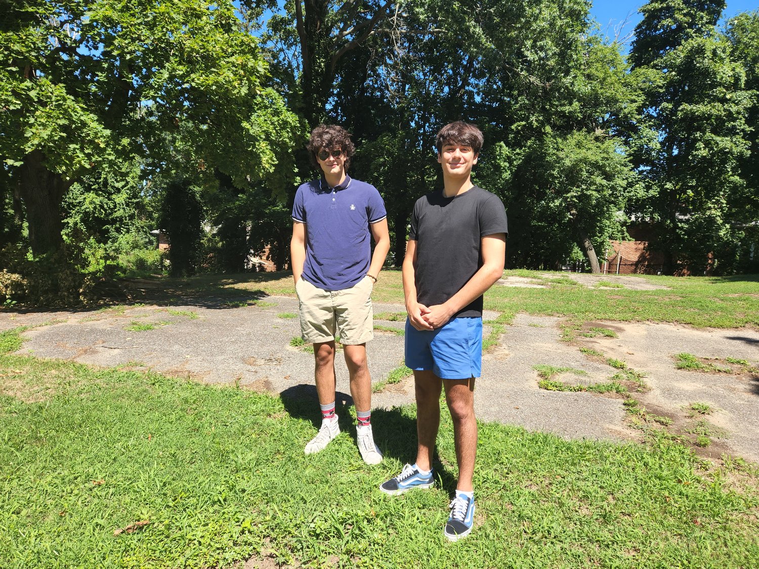 Glen Cove High School seniors William Santamaria, left, and Aiden Costella, plan to renovate Big Ralph Park, where one issue is cracked cement. They have started a Gofundme page to raise money for supplies.