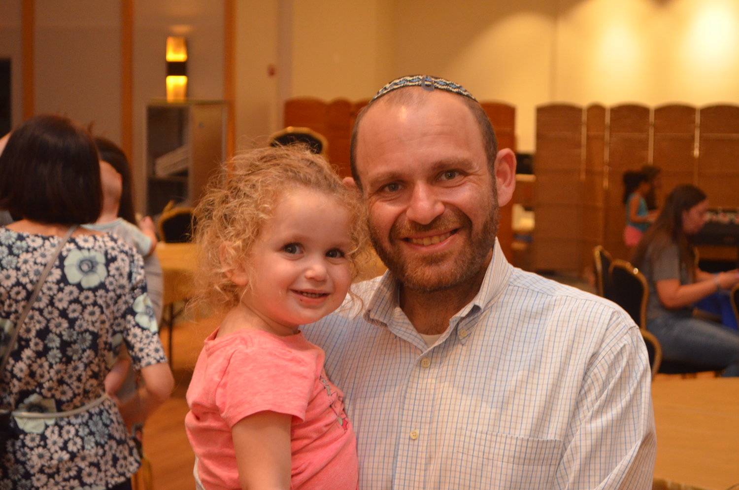 Rabbi Joshua Dorsch — here with his daughter, Ziva, at a Hebrew school open house — began his role at the Merrick Jewish Centre-Congregation Ohr Torah on July 15, filling a permanent    position left vacant by the now-retired rabbi Charles Klein.