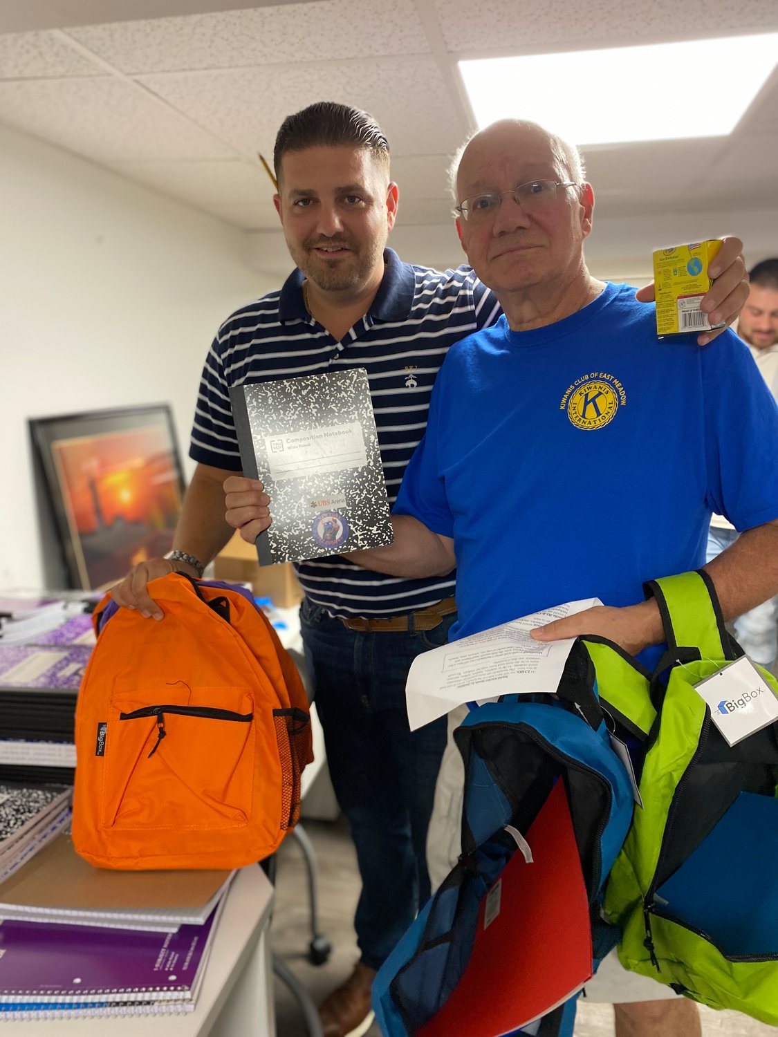 Richie Krug Jr., left, and Steve LaSala, teamed up to pack multiple backpacks at a time. 
The costs of back-to-school supplies has risen more than 25 percent over the past five years, meaning more students might have gone without.