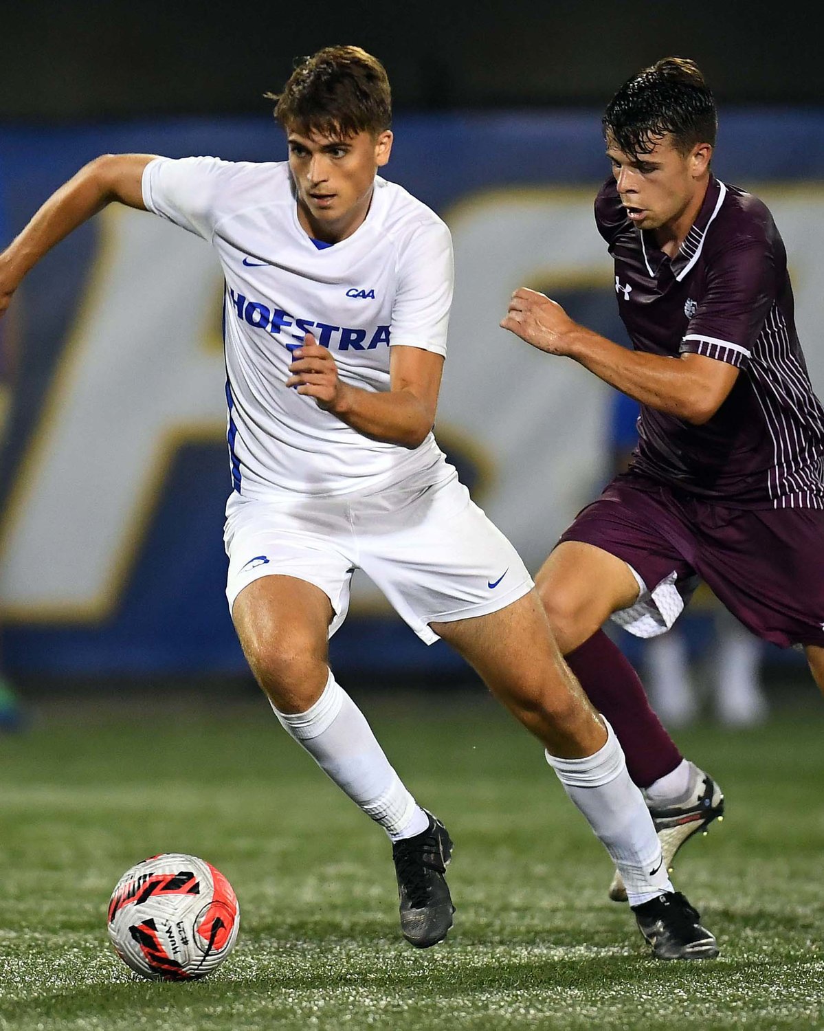 All-American midfielder Hendrik Hebbeker, left, was a big part of a prolific Hofstra offense in 2021 with 9 goals and 11 assists.