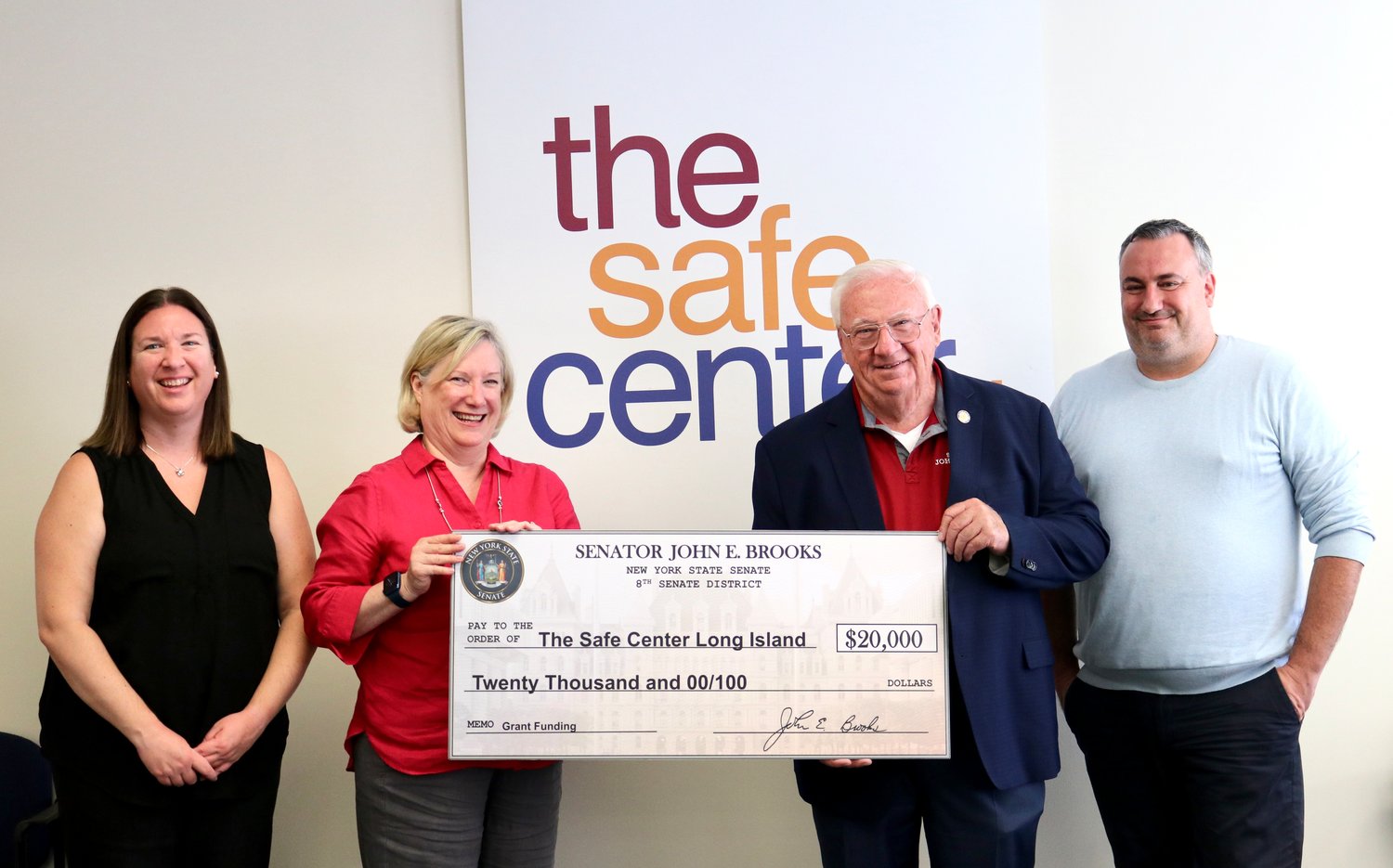 In an effort to support domestic violence and child abuse survivors, State Sen. John Brooks presented $20,000 to The Safe Center LI to aid its operations.