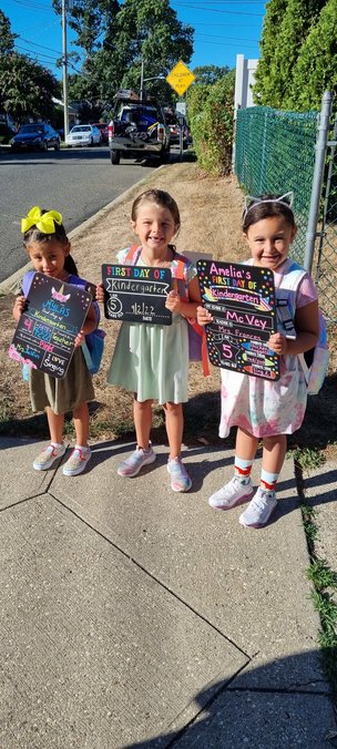 Myla Hernandez, far left, Rylie Hanson and Amelia Zafonte waited for the bus together on their first day of kindergarten at McVey Elementary School.