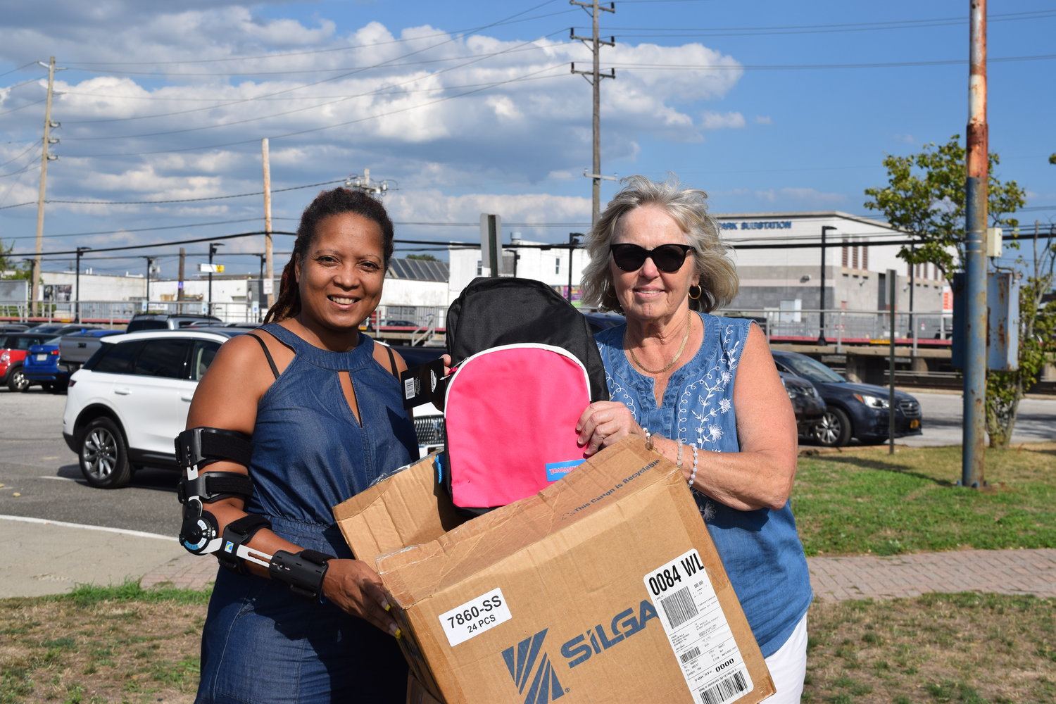 Janice Gause received a backpack stuffed with school supplies from Legislator Denise Ford.