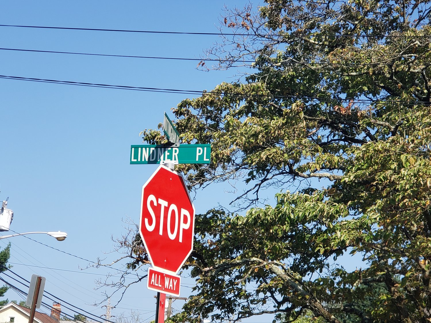 The streets signs for Lindner Place, originally named for a prominent member of the Ku Klux Klan, will soon be replaced by signs bearing the name “Acorn Way.”