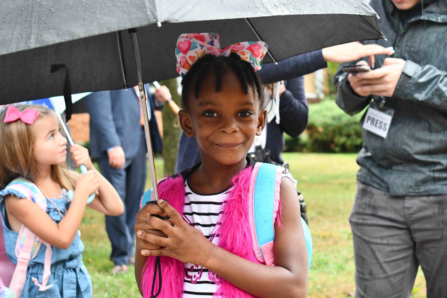 Five-year-old Moana, who will be staring Kindergarten, stood outside Maurice W. Downing School in Malverne as students filtered in for their first day of school.