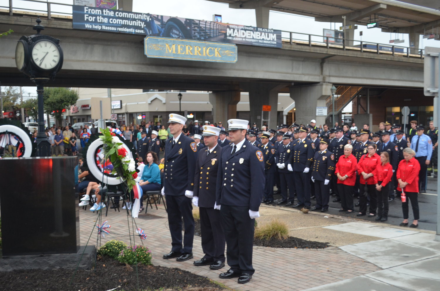 Wreathes in honor of the Merrick department’s ex-chief Ronnie Gies and ex-captain Bryan Sweeney are laid out every year.