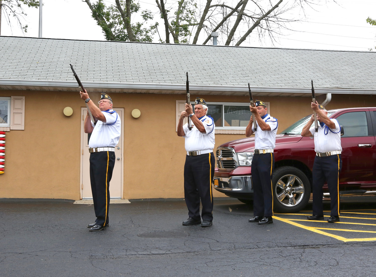 Wantagh American Legionnaires fire a 21-gun salute in a tribute to those who lost their lives on Sept. 11, 2001.