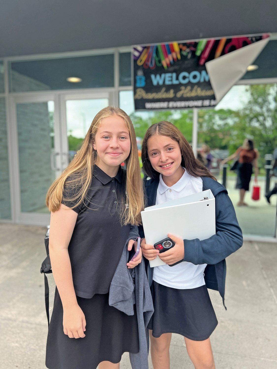 Seventh-graders Leah Minkov, left, and Charlotte Isler on the first day of school at the renamed Brandeis Hebrew Academy.