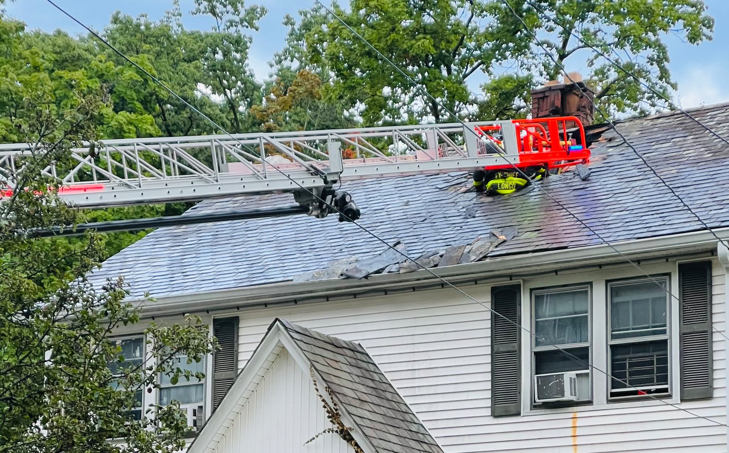 Landing Road was filled with police and firetrucks from surrounding fire departments on Tuesday to help combat the house fire.