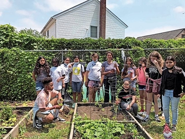 Five Towns teenagers came together to help out at the Community Center garden.