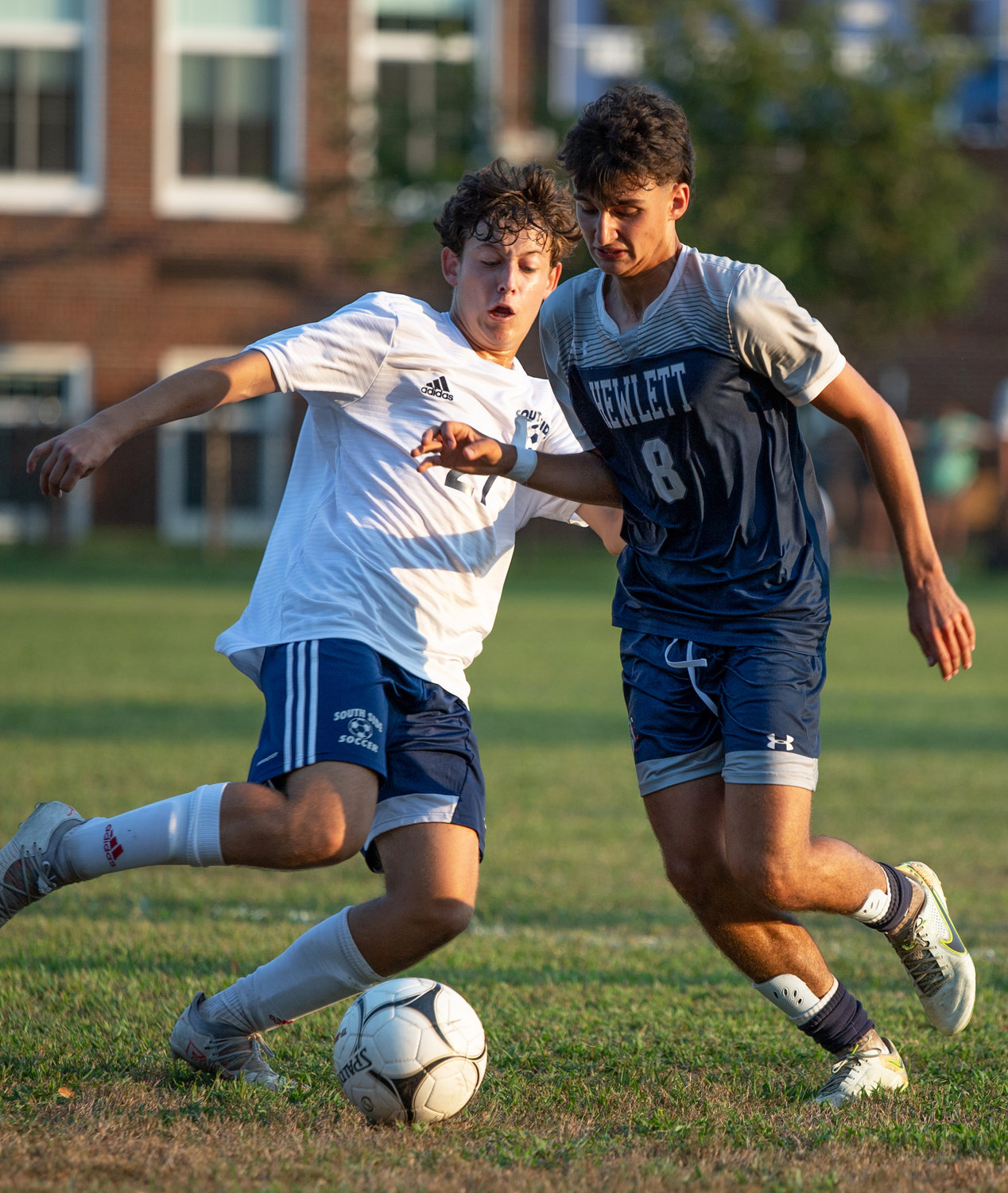South Side’s Patrick Costello, left, and Hewlett’s Eric Riftin battled for control during a Conference A-Central matchup Sept. 14.