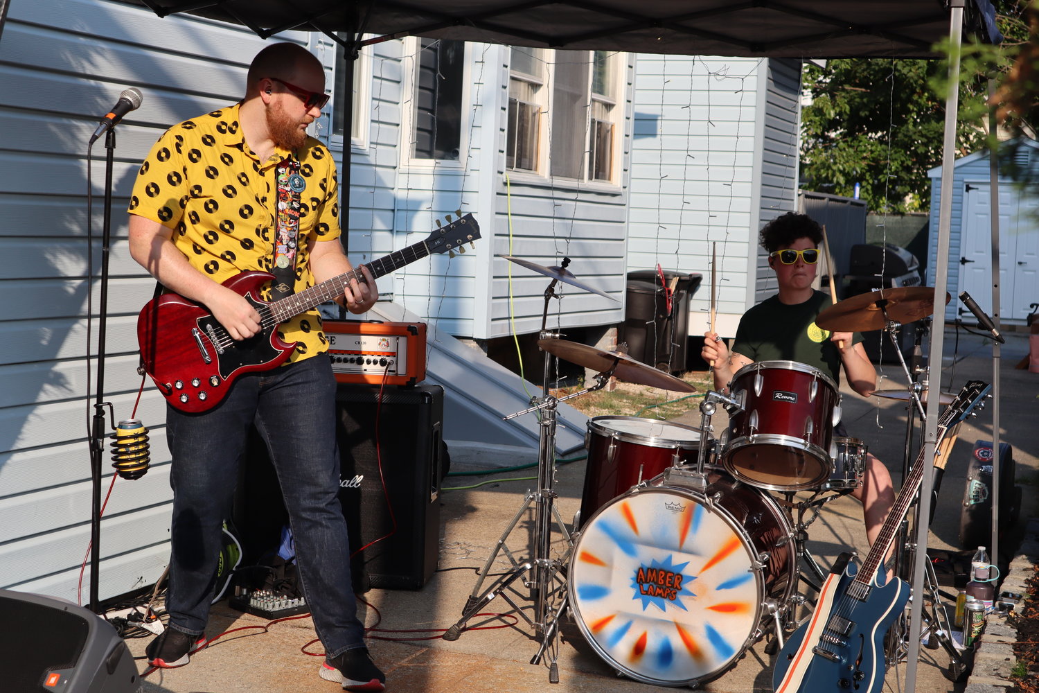 Astoria based punk rock band Amber Lamps play along St. Marks Avenue for the Playing on the Porch concert series.