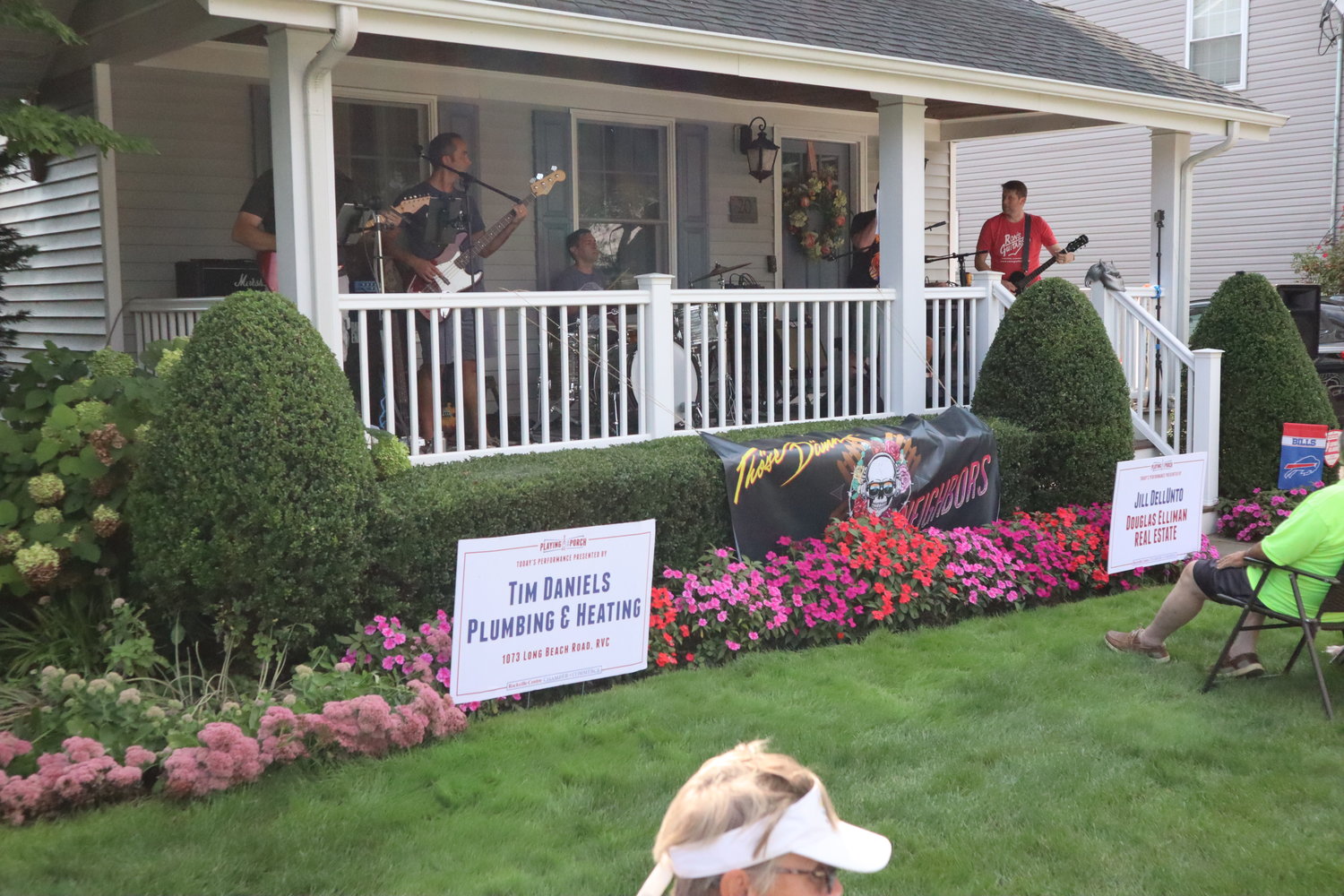 Those Damn Neighbors perform on the front porch of this home on Linden Street.