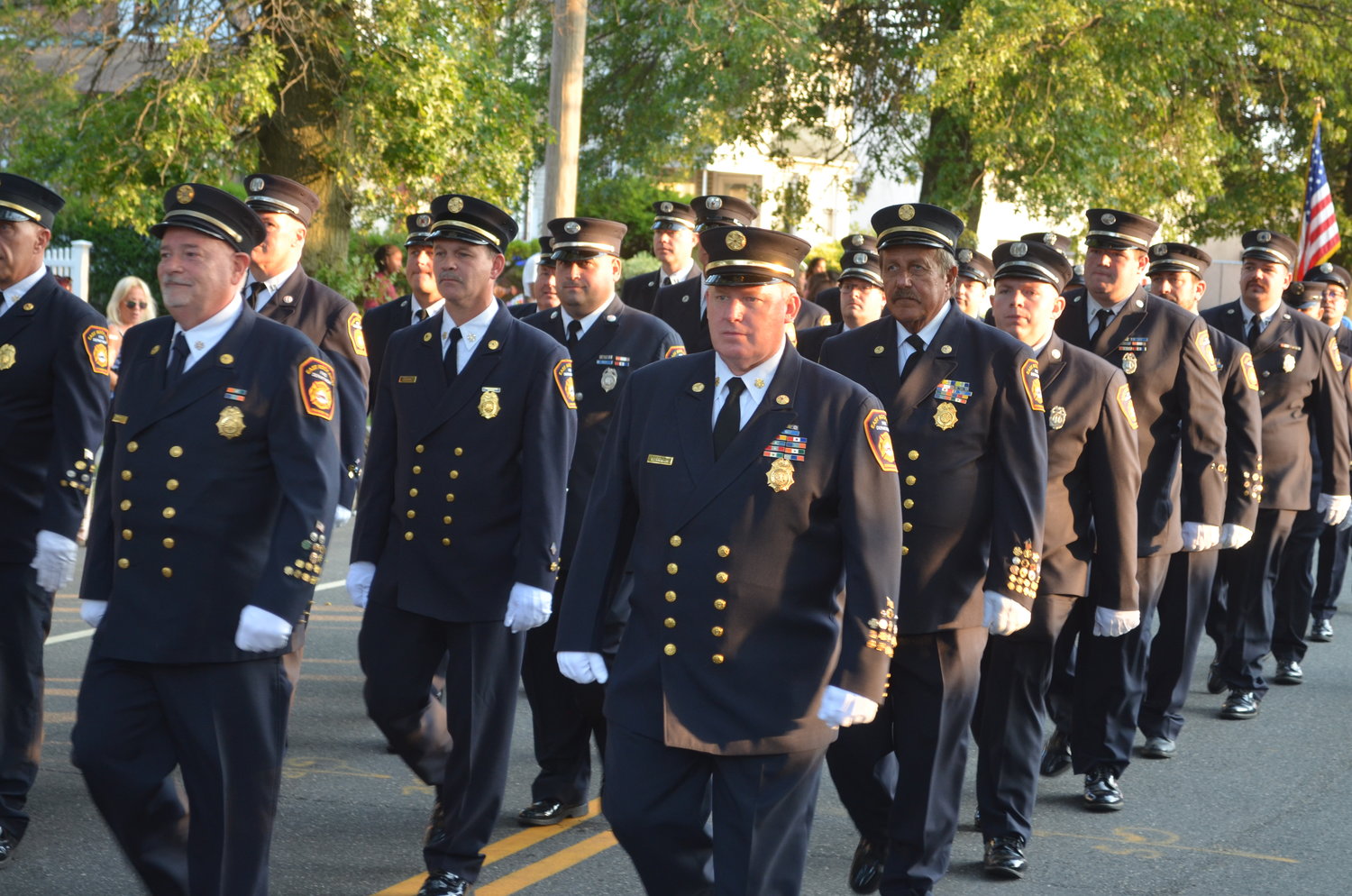 Members of the East Rockaway Fire Department march along Atlantic Avenue during the annual Fourth Battalion Fire Parade on Saturday.