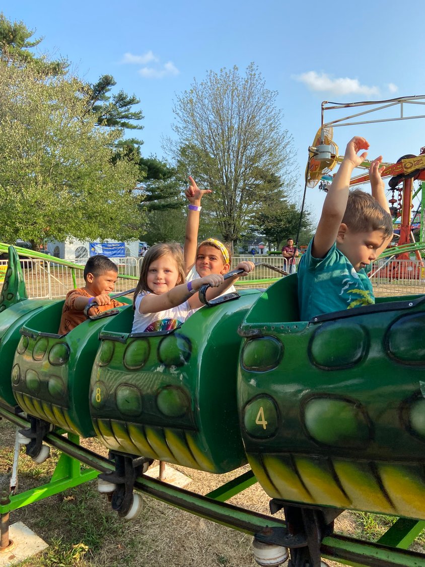 Cousins Berkeley Raab, 4, left, and Mackenzie Krug, 5, had a blast on the dragon-themed kiddie coaster.