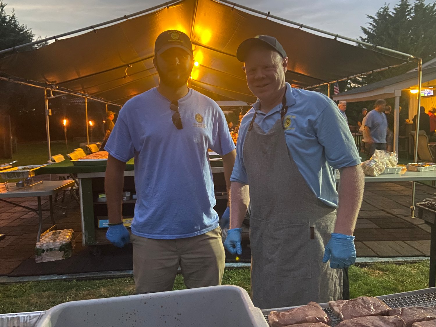 Legion member Mike Leake, right, did most of the cooking for the Steakout. Steven Papagni, left, gave him a helping hand.