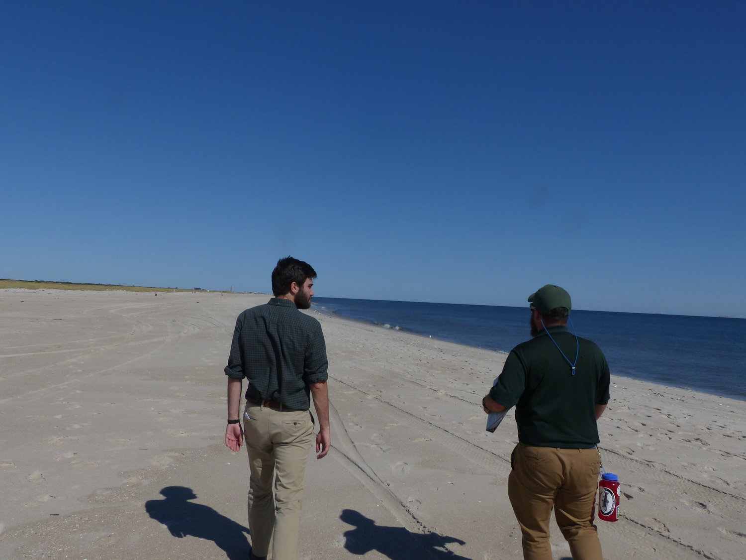 Environmental educator Hayden Urysk, right, leads visitor Kevin Donohue around the beach and teaches him Jones Beach’s history.