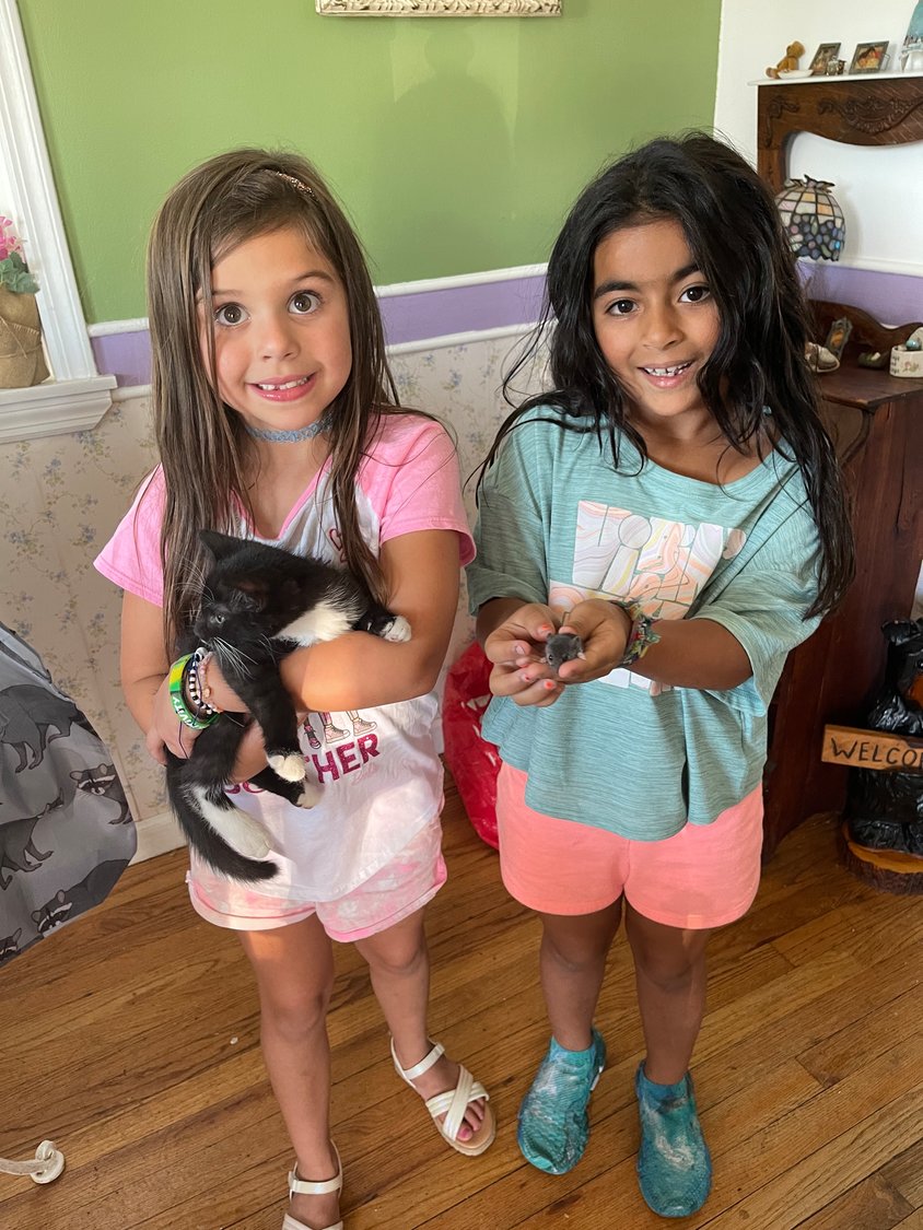 Dahlia’s desire to help animals extends even to mice, like this baby, which she’s holding at right, and which she and her friend Olivia Lovallo helped rescue.