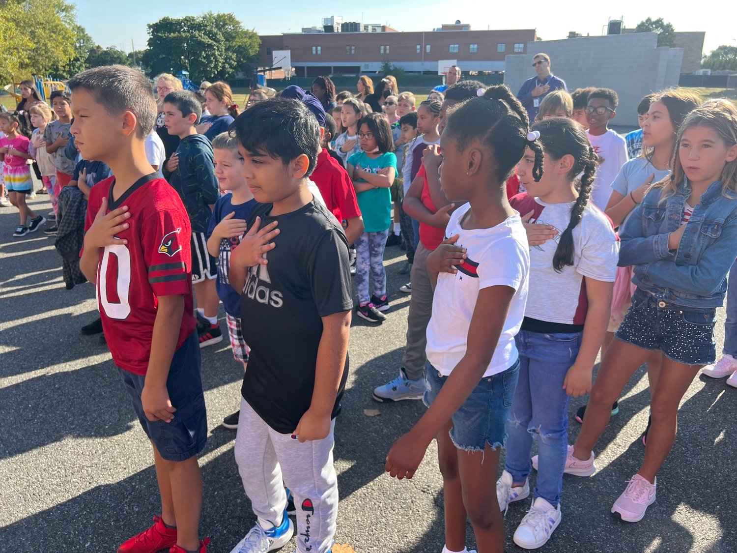 James A. Dever Elementary School students sung the national anthem and recited poems on the meaning of heroism seen throughout the country during the September 11 terrorist attacks.