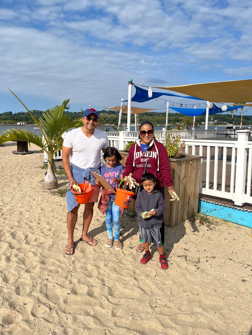 Amar, above left, Asha, Vee and Shay Jhaveri cleaned Tappen Beach.