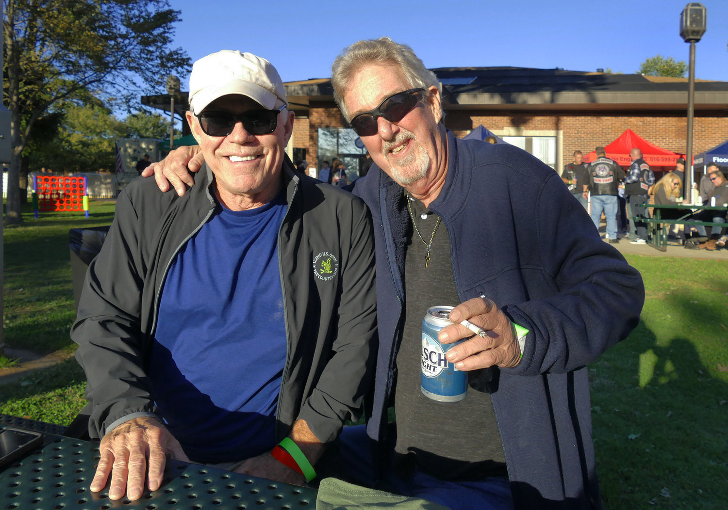 John Derenches and Tom McGrane enjoy the Wounded Warriors event on Saturday.