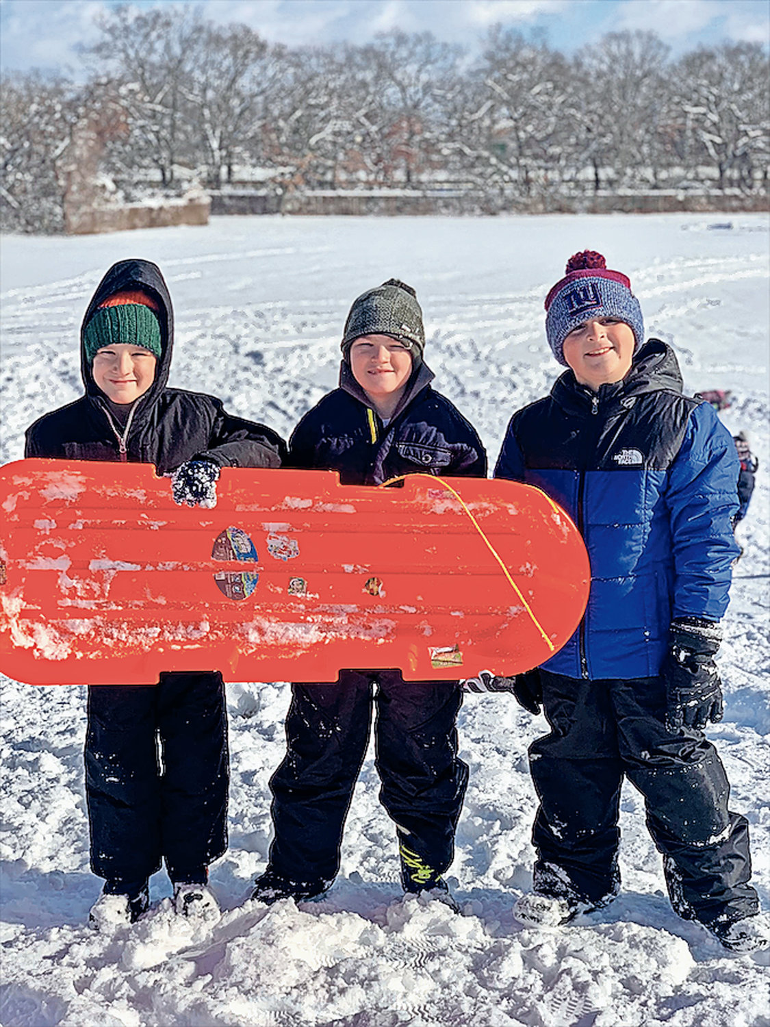 From left, Xavier David, Maceo Barry and Nicholas Vecchiano enjoyed sledding during a snow day in January.