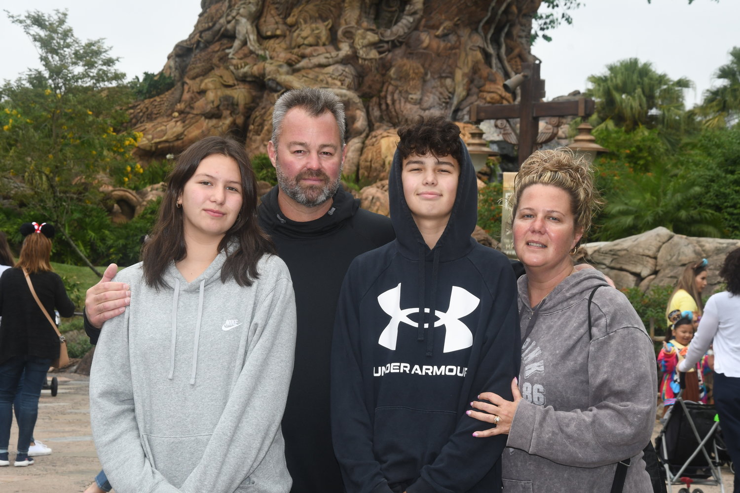 Dino Komis, second from left, died in June. Dino, his wife, Rose, far right, and their children, Teddy, 14, and Nina, 12, visited Disney World last November.