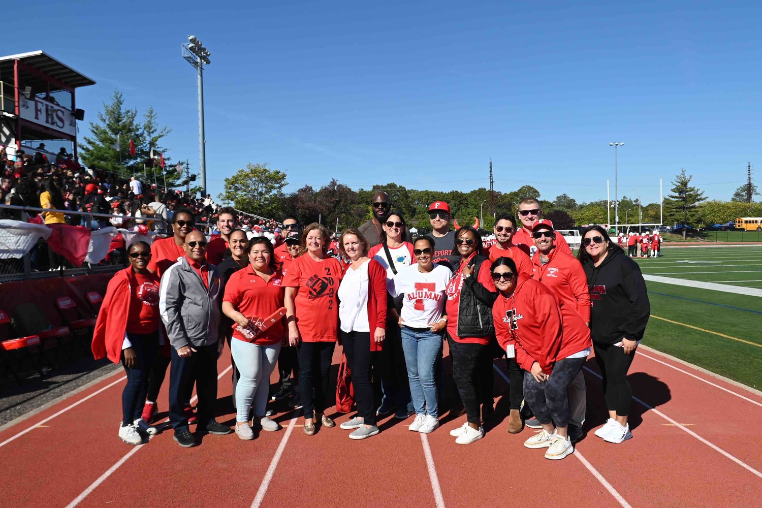 Superintendent of Schools Dr. Kishore Kuncham (second from left front row) and Board of Education President Maria Jordan-Awalom (third from left front row) were joined by administrators and local political representatives during homecoming.