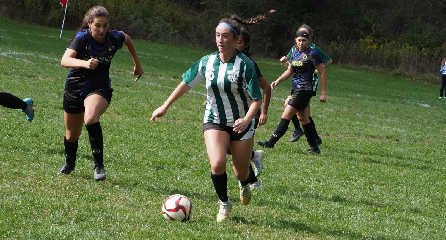 Kailey Dunne, No. 6, runs the ball up through the midfield to push the team ahead in the tournament.