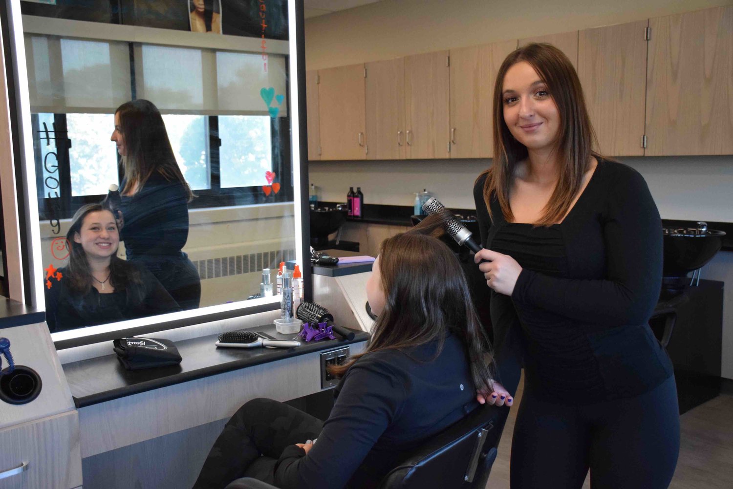 The Bellmore-Merrick Central High School District’s cosmetology program celebrated the grand opening of its new salon suite last month, the centerpiece of its cosmetology program. Vanessa Monteleone styled her sister Ashlee’s hair.