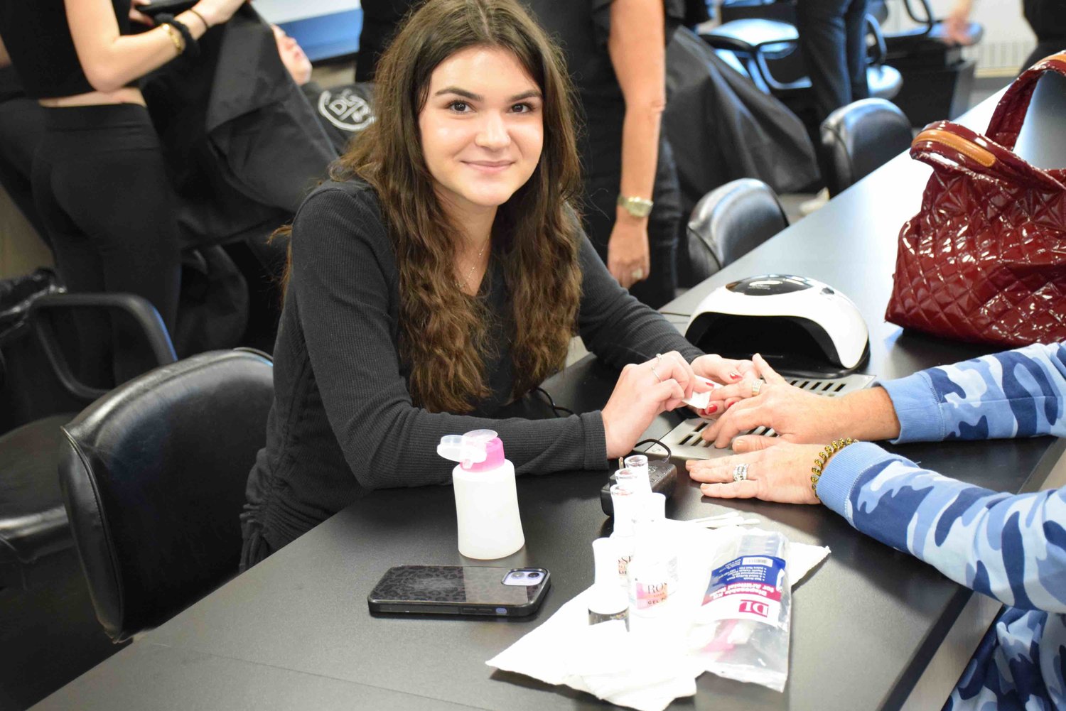 Rebecca Zollo gave a manicure at a new table meant specifically for nail work.