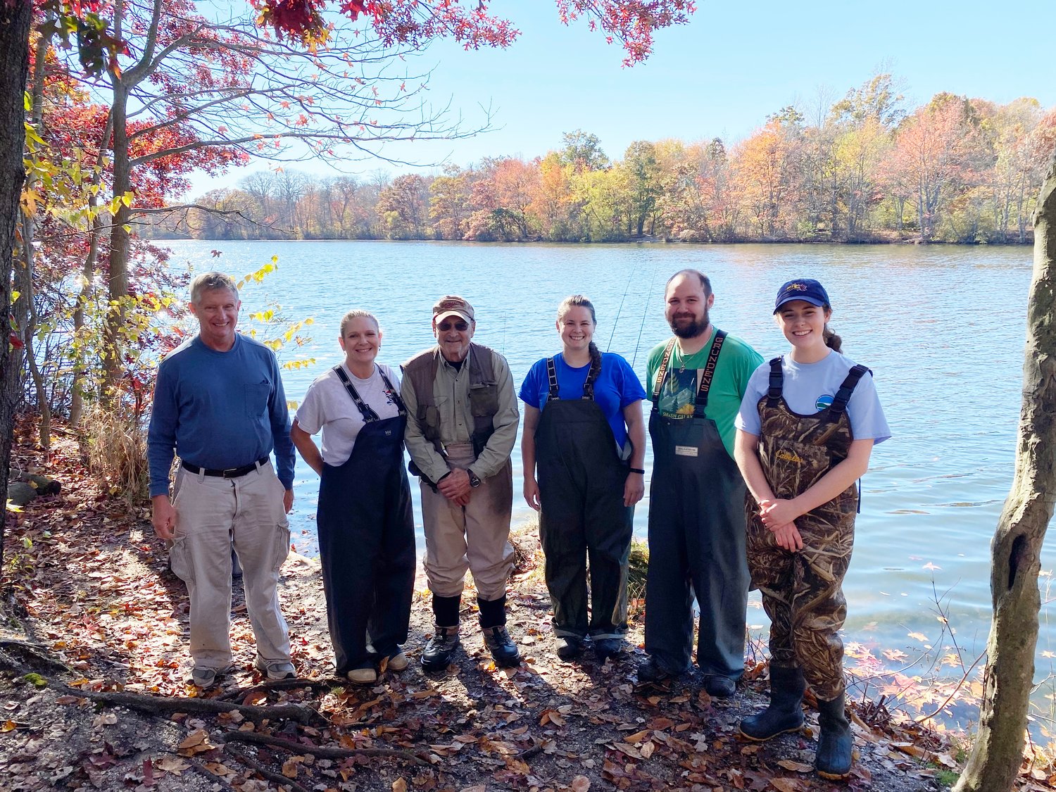 NYSDEC workers and volunteers Bill Fonda, Heidi O’Riordan, Marty Weinstein, Rebecca Terry, Joshua Laedke, and Lauren Tuffy helped stock brown trout in Wantagh’s Upper Twin Pond.