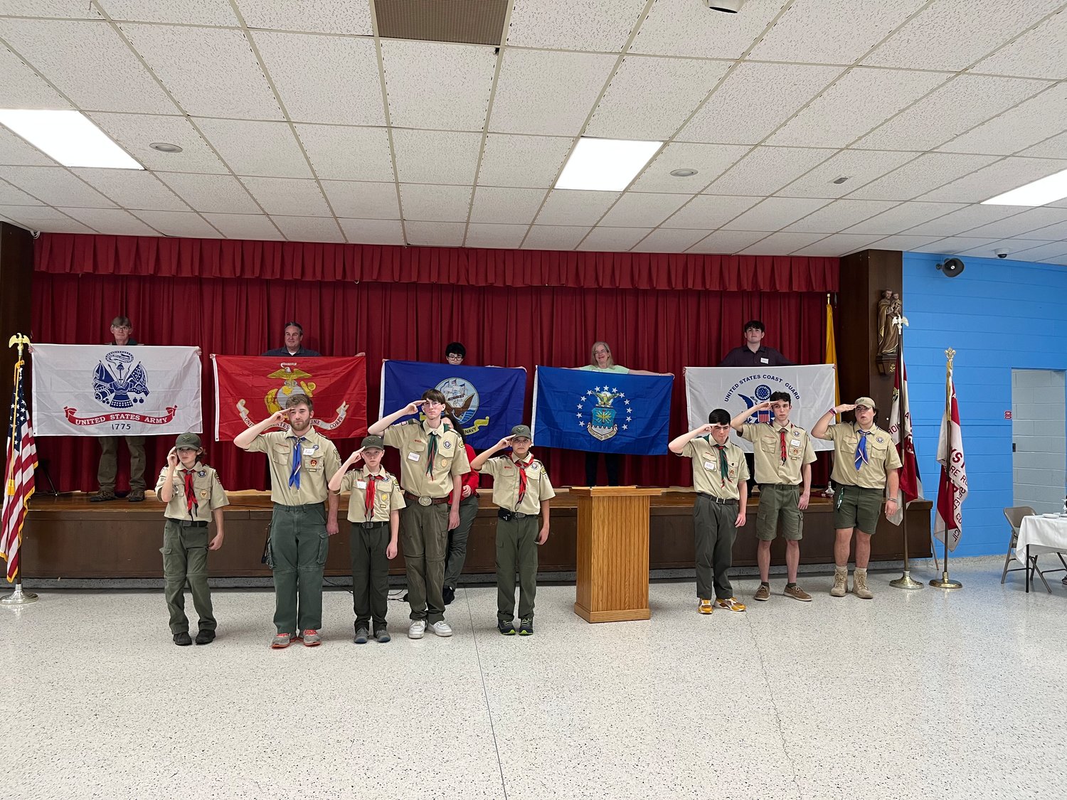 Members of Oyster Bay Boy Scout troops honored veterans at the Veterans Day dinner at Saint Dominic Church, amid the playing of the anthems of the different branches.