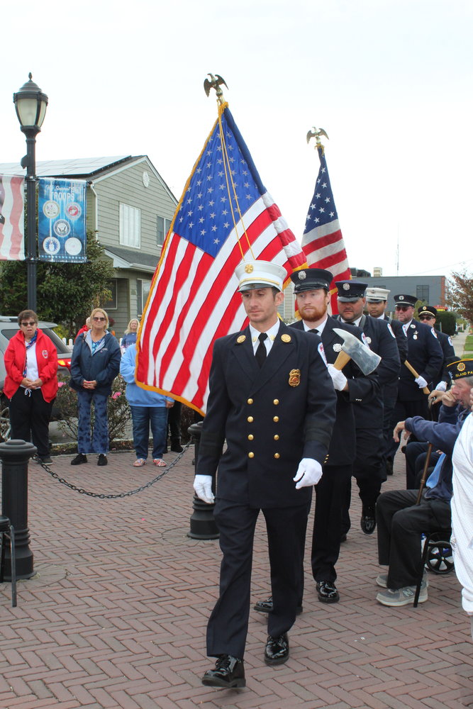 The Island Park color guard began the ceremony by presenting the American flag.