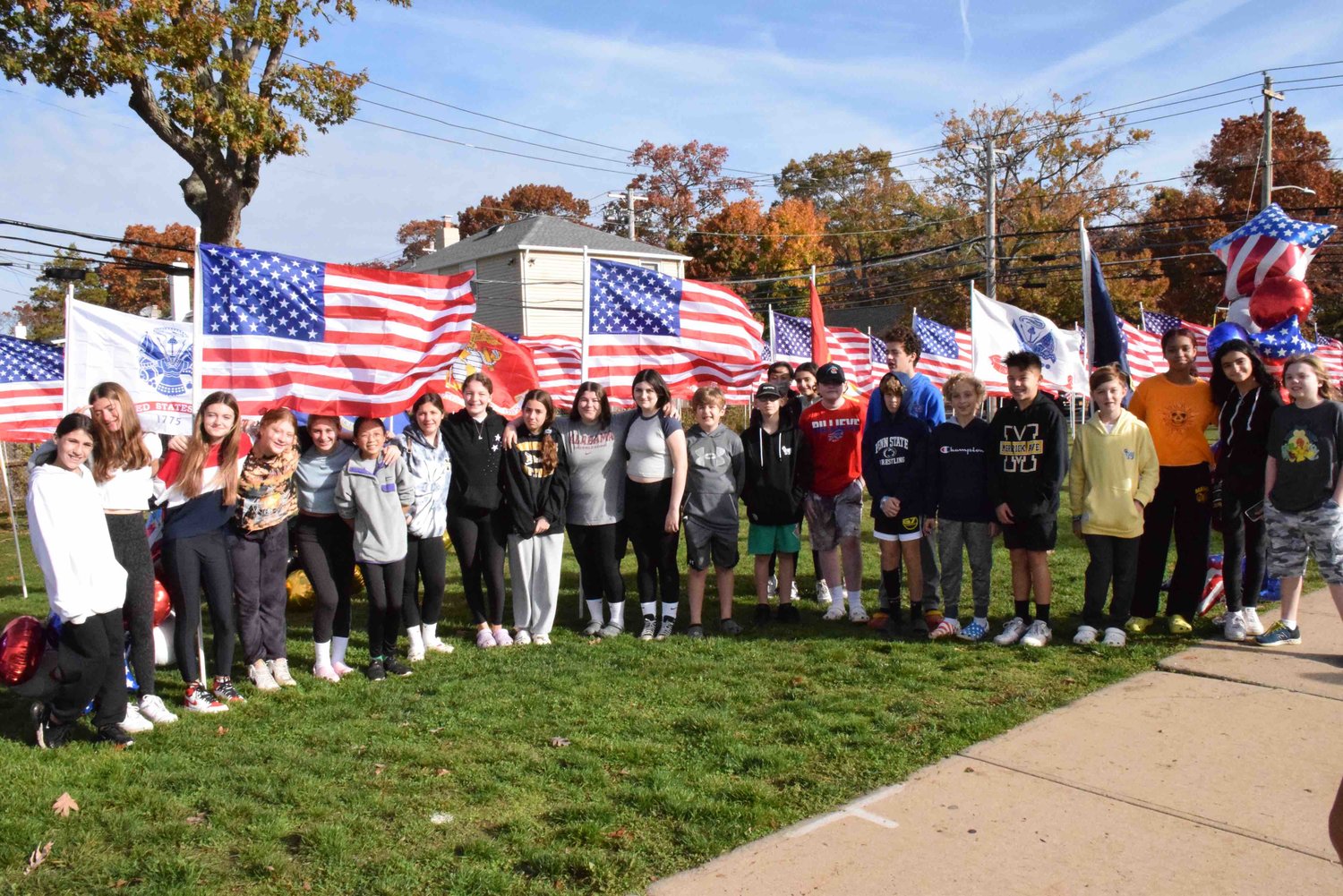 A large group of students volunteered at Merrick Avenue Middle School’s flag installation. Through sponsorships, the school raised $2,450 in proceeds that will be donated to Honor Flight Long Island for veterans, and the Bellmore-Merrick Community Cupboard.