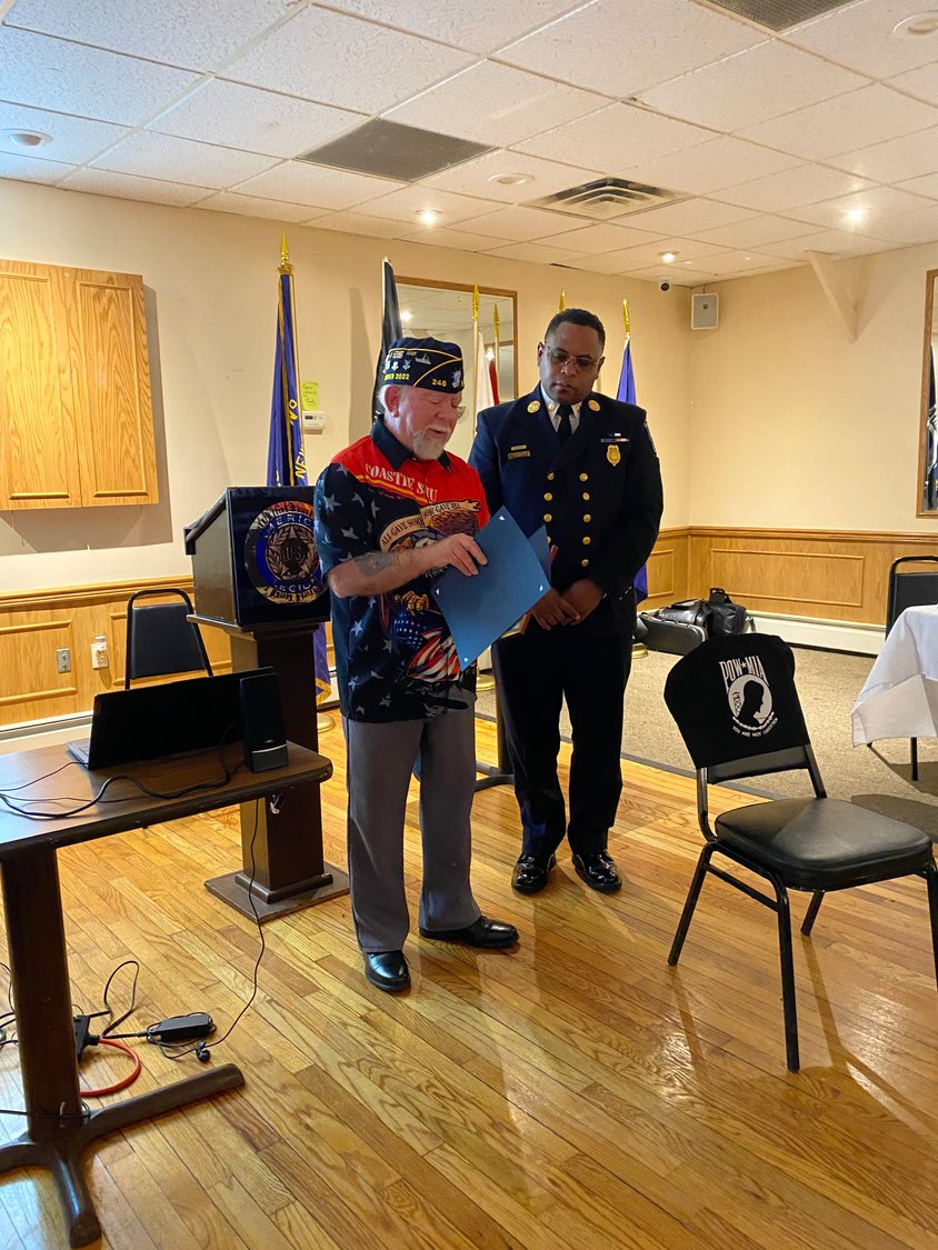 Stu Cohen, commander of Baldwin American Legion Post 246, left, honored several veterans,    including Baldwin Fire Chief Brien Cummings, who served in the Army.