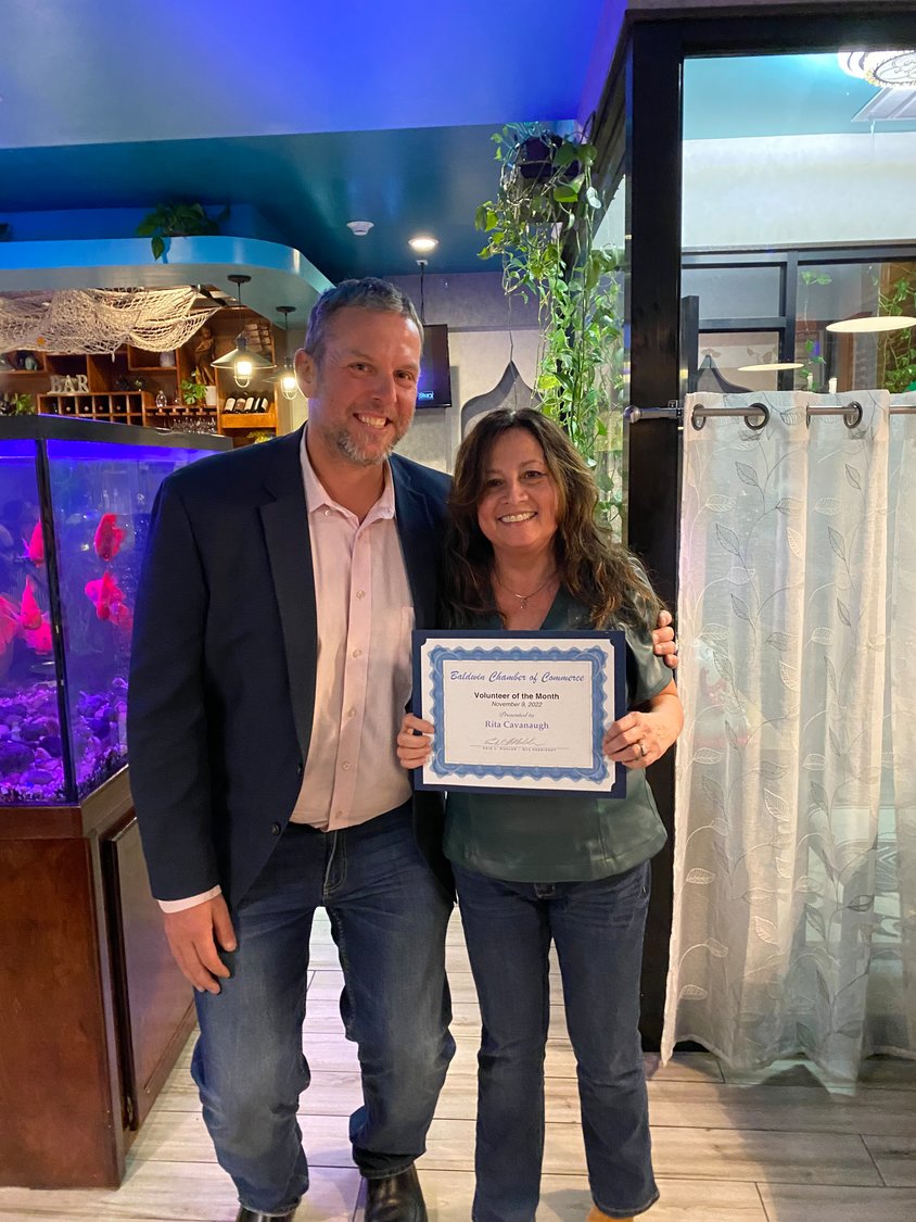 Chamber of Commerce president Erik Mahler presented a volunteer of the month award to Rita Cavanaugh , head of the Baldwin Civic Association’s beautification committee, for her work and contributions to starting the Baldwin Community Garden.