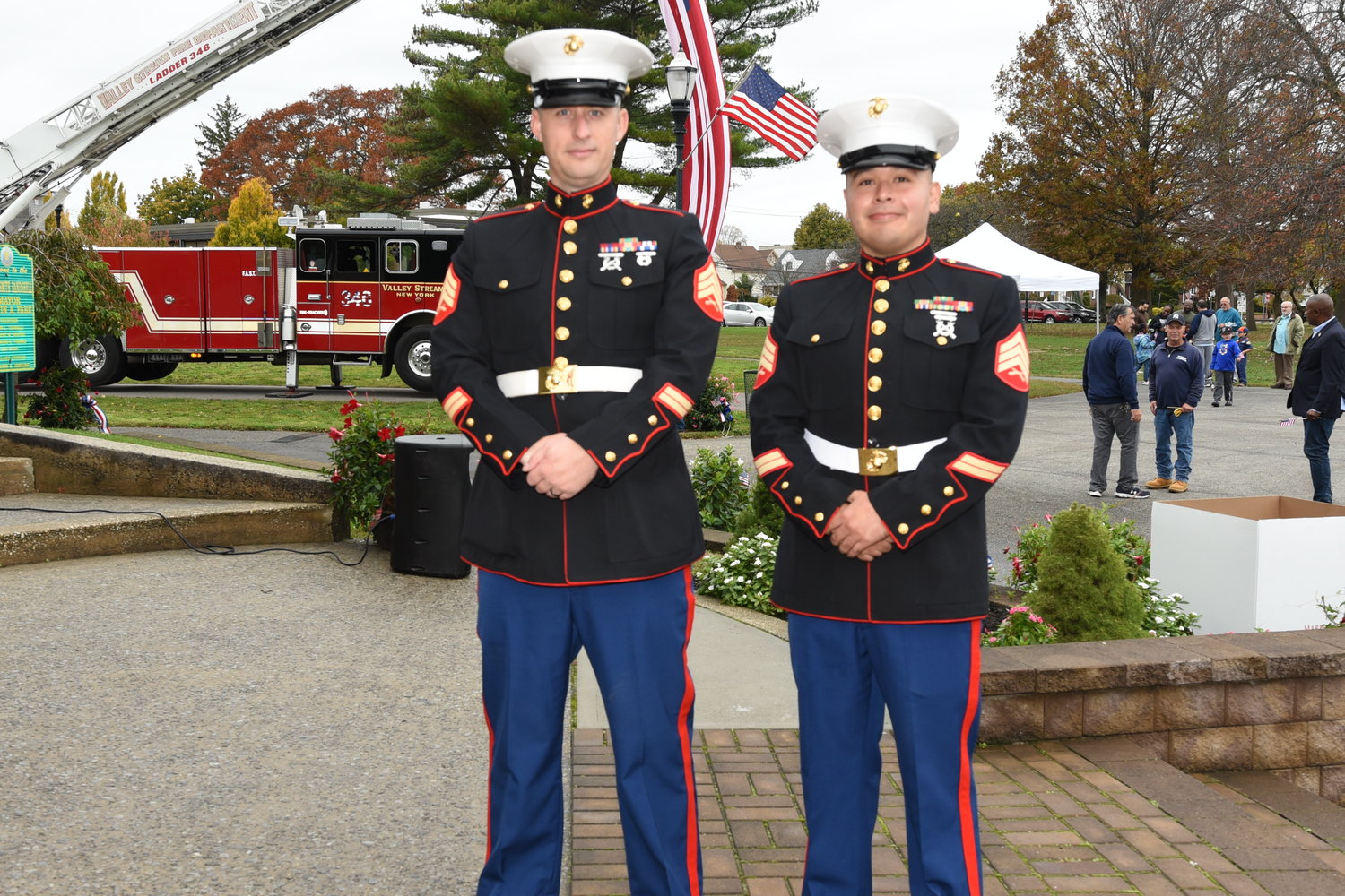 Marine Sargent Jason Dunn and Carlos Yales joined in saluting veterans and fellow service members at the alley Stream Veterans Day celebration.