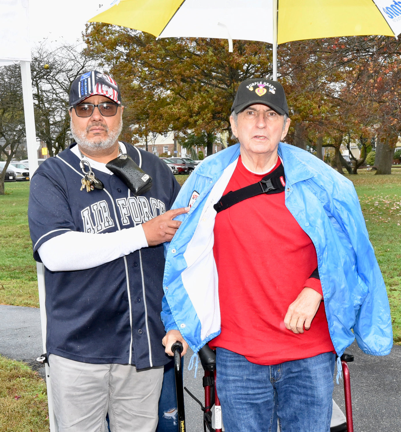 Eric Morales, a U.S. Air Force veteran, and Thomas Holloran, a U.S. Marine veteran, from left, joined the village as they paid tribute to them and countless others at the Veterans Day ceremony.