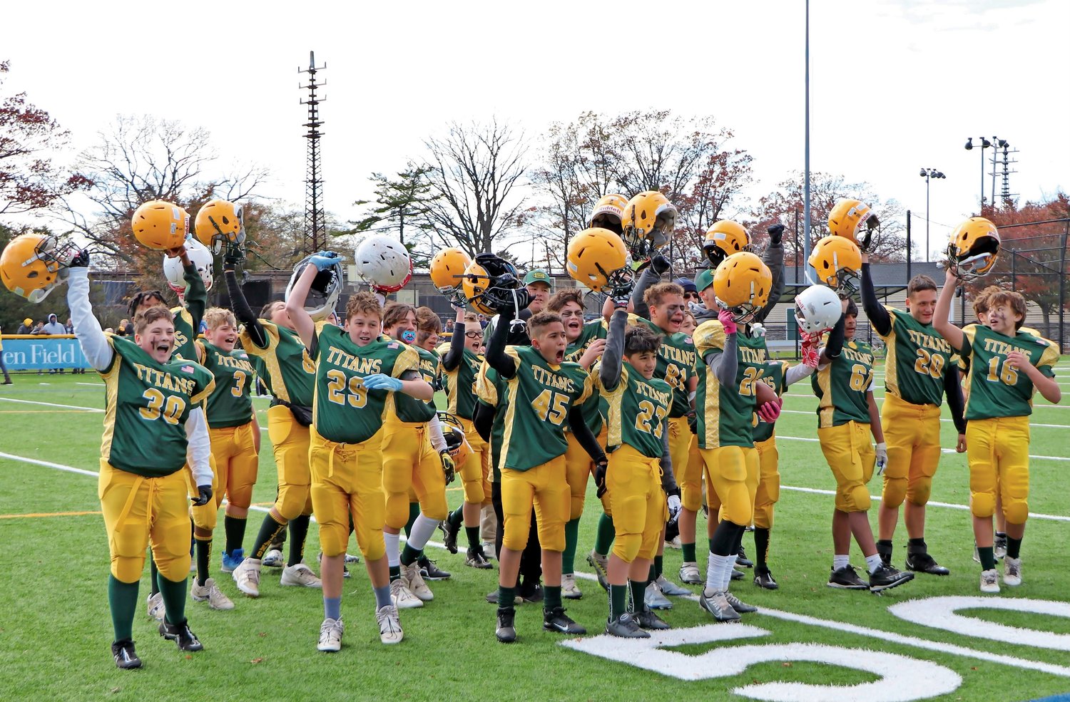 The 12 year-old Titans Football team cheering as they won their playoff game.