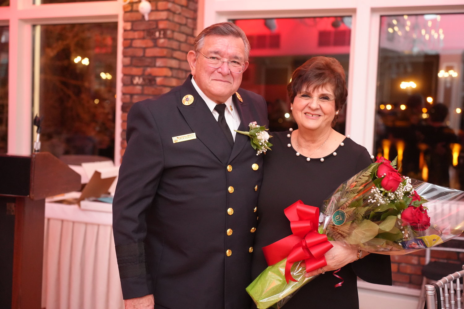Jack Dziedzic, ex-captain and a trustee for Merrick Hook and Ladder Company No. 1, was honored this weekend for 50 years of service to the community. Dziedzic, above, with his wife, Emily.