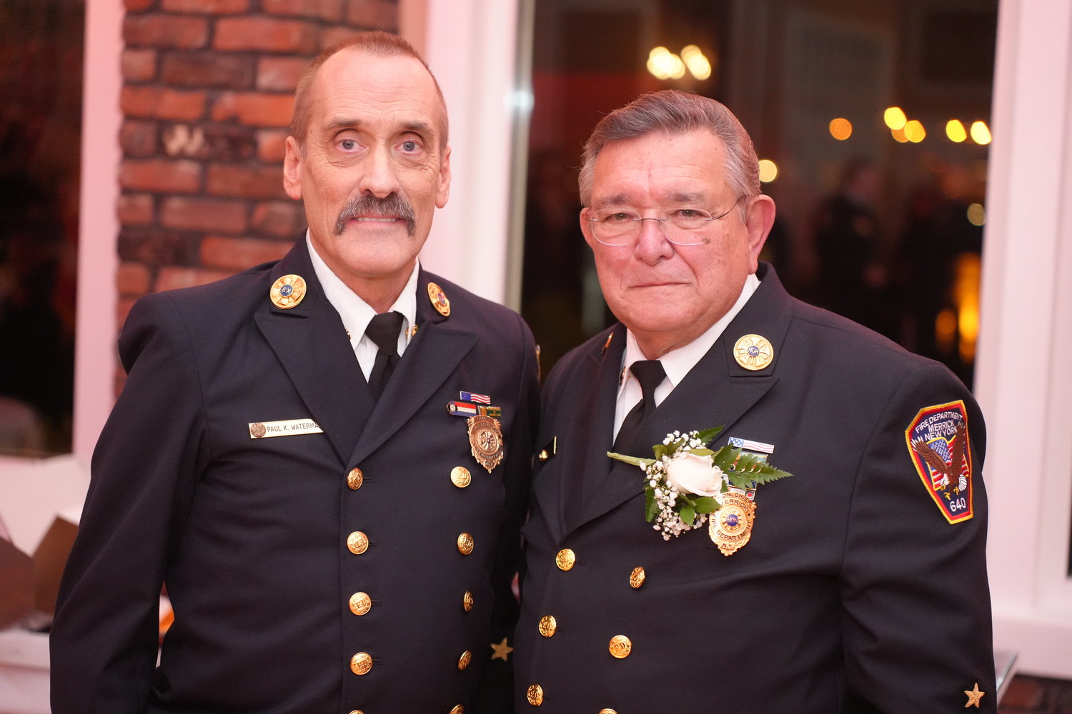 Dziedzic’s friend, ex-chief Paul Waterman, left, led the ceremony at the Coral House in Baldwin.