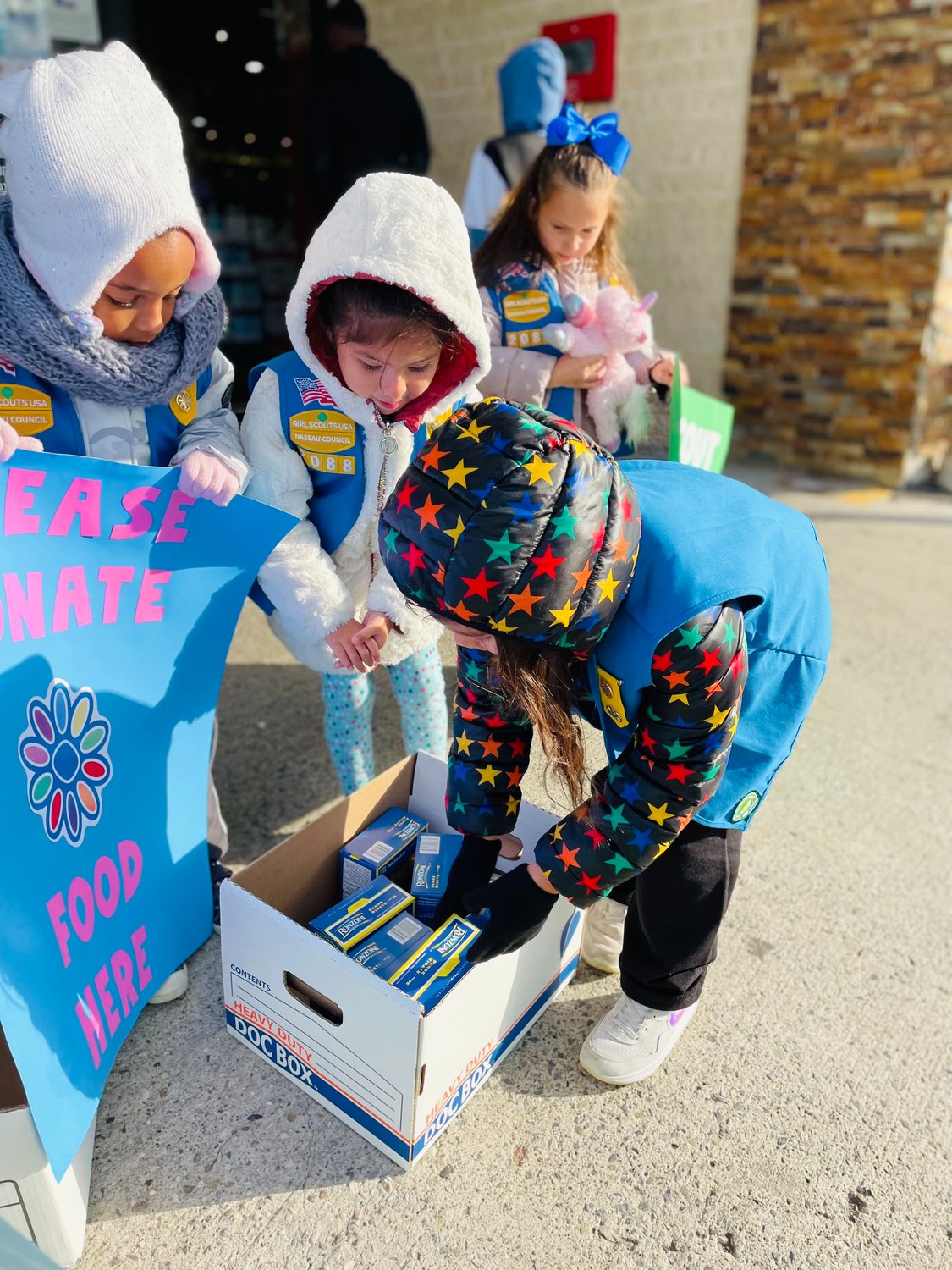 Girl Scout Troops collected over four boxes of food and over 70 dollars in monetary donations for St. Christopher's Church's Food Drive last week.