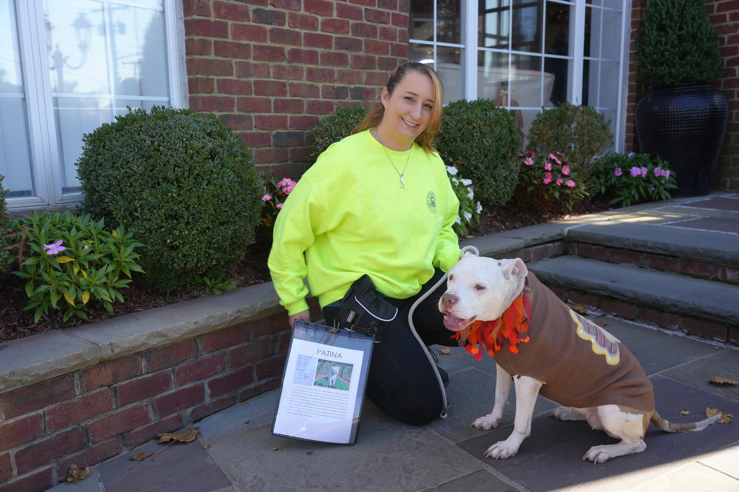 Meghan Raedy, a Town of Hempstead Animal Shelter employee from Hicksville with Patina, one of the shelter dogs.