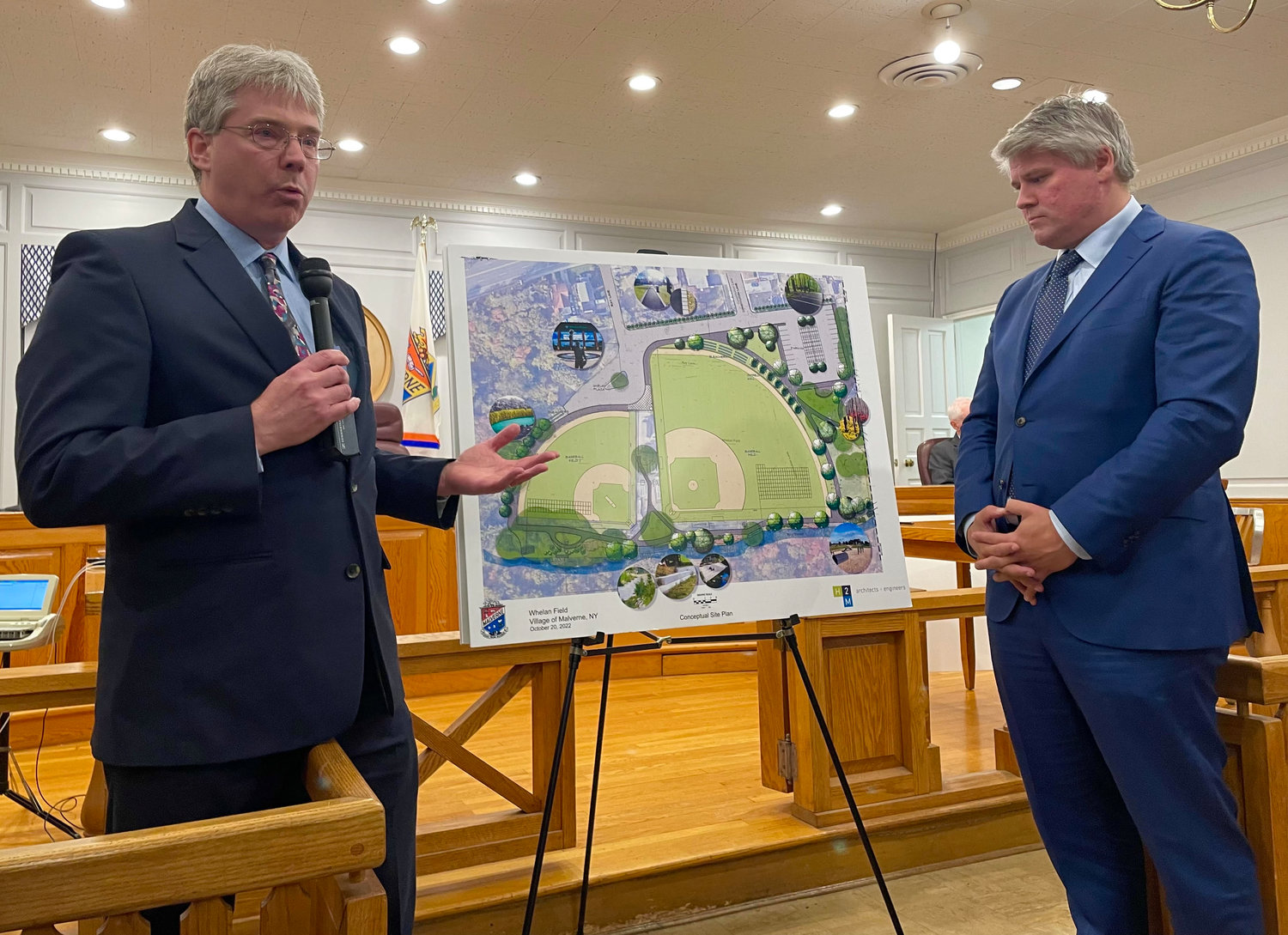 Matthew Mohlin, vice president of the architectural firm H2M, left, joined Corbett at a village board meeting on Oct. 20 for a presentation on a number of proposed upgrades to Whelan Field.